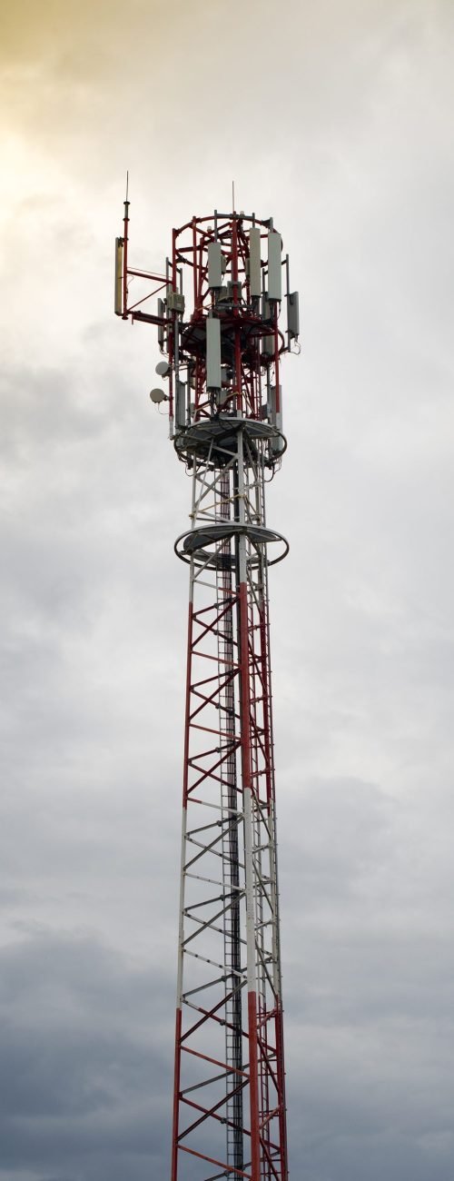 Telecommunication tower. Wireless Communication Antenna Transmitter. Development of communication systems in urban area at sunset.