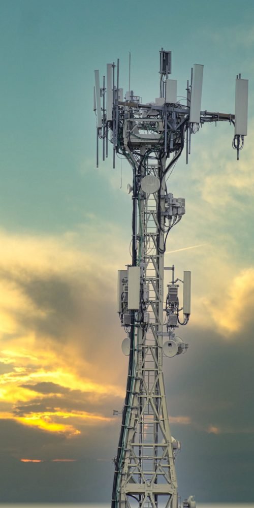 Telecommunications radio tower under dramatic sky